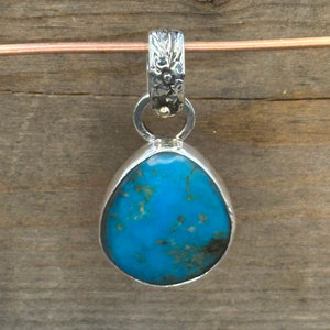 Turquoise Set in Sterling Silver with Floral Bail and 14k Accent