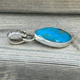 Turquoise Set in Sterling Silver with Floral Bail and 14k Accent