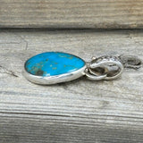 Turquoise Set in Sterling Silver with Floral Bail and 14k Accent